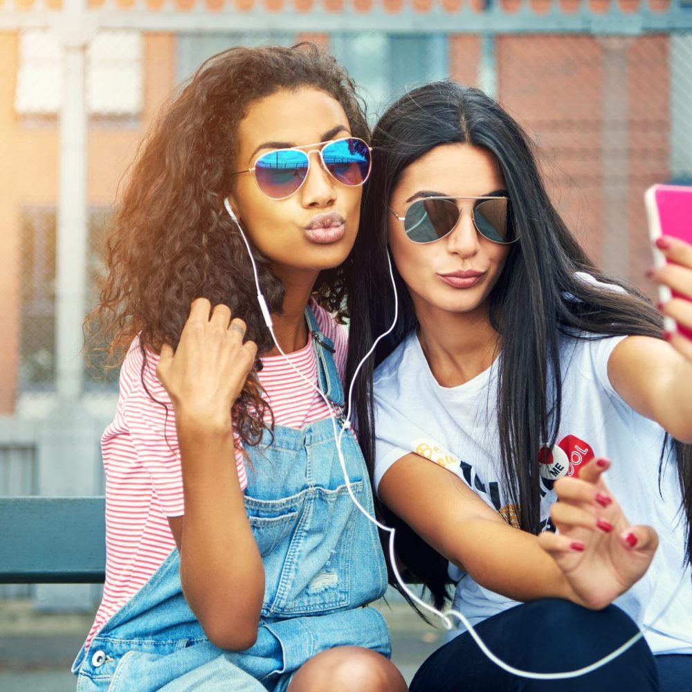 lovely-women-making-faces-take-photo-by-tall-fence-2025-10-02-21-16-48-utc